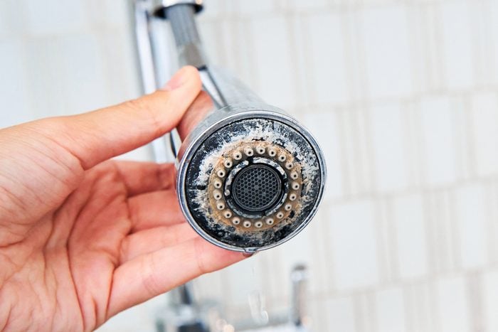 Shower head with calcium and mineral buildup